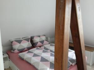 a bedroom with a bunk bed with a mirror at Ferienwohnung Backbord in Büsumer Deichhausen