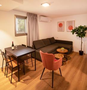a living room with a couch and a table at Sublet TLV 270 in Tel Aviv
