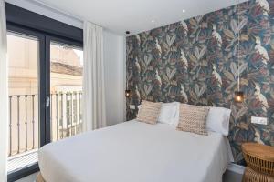 Postel nebo postele na pokoji v ubytování Apartamentos 7 dreams