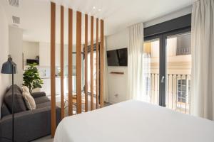 Postel nebo postele na pokoji v ubytování Apartamentos 7 dreams