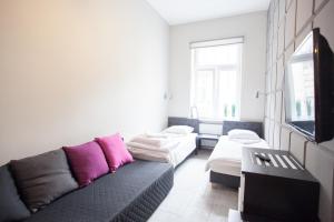 Telewizja i/lub zestaw kina domowego w obiekcie Rent-Apart City Center Lodz