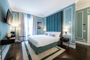 Postel nebo postele na pokoji v ubytování Glimpse Hotel
