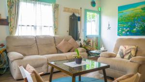Posezení v ubytování beach house Cg7p