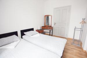 Łóżko lub łóżka w pokoju w obiekcie Rent-Apart City Center Lodz