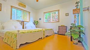 Postel nebo postele na pokoji v ubytování beach house Cg7p + 37 fotografií