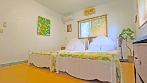Postel nebo postele na pokoji v ubytování beach house Cg7p