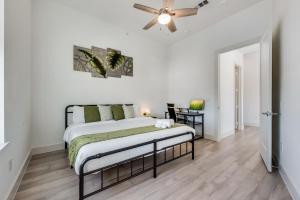 a bedroom with a bed and a ceiling fan at Contemporary 2BR I Gym I Parking I Workspace in Dallas