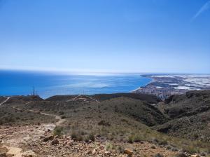 a view of the ocean from the top of a mountain at Apartamentos Aguadulce in Aguadulce