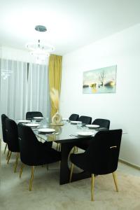 a dining room with a table and chairs at Curve Hostel JBR in Dubai