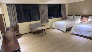 Ein Bett oder Betten in einem Zimmer der Unterkunft Just live inn - New Dahua