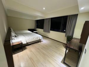 Ein Bett oder Betten in einem Zimmer der Unterkunft Just live inn - New Dahua