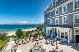 a view of the beach from the balcony of a building at Harbour Hotel & Spa St Ives in St Ives