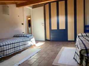 Ένα ή περισσότερα κρεβάτια σε δωμάτιο στο Casa in pietra in collina