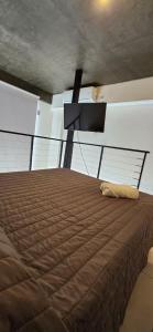 Giường trong phòng chung tại Casita de Tucumán - Loft San Martin