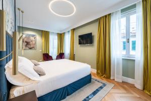 Postel nebo postele na pokoji v ubytování Glimpse Hotel