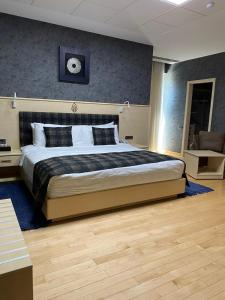 Postel nebo postele na pokoji v ubytování Badam d'Art Boutique Hotel