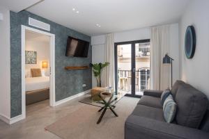 TV a/nebo společenská místnost v ubytování Apartamentos 7 dreams