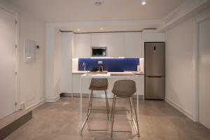 Kuchyň nebo kuchyňský kout v ubytování Apartamentos 7 dreams