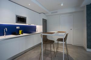 Kuchyň nebo kuchyňský kout v ubytování Apartamentos 7 dreams
