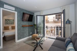 TV a/nebo společenská místnost v ubytování Apartamentos 7 dreams