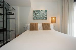 Postel nebo postele na pokoji v ubytování Apartamentos 7 dreams