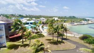 an aerial view of a resort and the ocean at The Ohana Studio in Saint-François