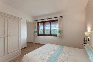 Postel nebo postele na pokoji v ubytování Résidence Pierre & Vacances Vignola Mare