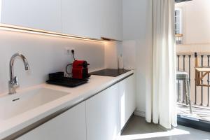 Kuchyň nebo kuchyňský kout v ubytování Apartamentos 7 dreams