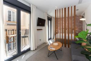 TV a/nebo společenská místnost v ubytování Apartamentos 7 dreams