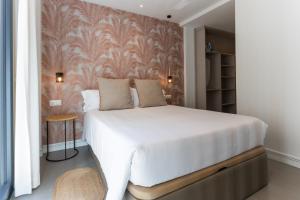 Postel nebo postele na pokoji v ubytování Apartamentos 7 dreams