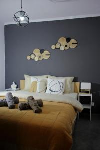 a bedroom with a large bed with a blue wall at Center Of Elegance in Xanthi