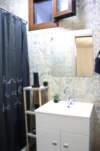 a bathroom with a sink and a mirror at Center Of Elegance in Xanthi