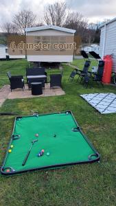 a green pool table in the grass in a park at 6 dunster court haven park doniford bay in Watchet