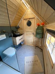 a view of a small kitchen in a tiny house at Le Tiki de Coucou in Foncine-le-Haut