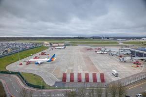 an airport with several airplanes parked in a parking lot at Hilton Garden Inn Birmingham Airport Uk in Bickenhill