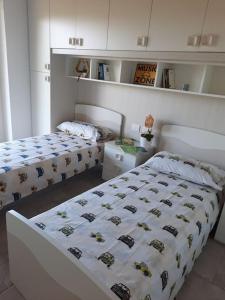 Postel nebo postele na pokoji v ubytování VILLA MILLEFIORI