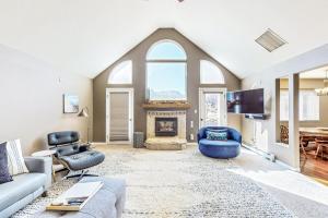 a living room with a couch and a fireplace at Casa Rimrock in Grand Junction