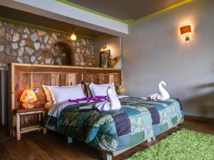 Katil atau katil-katil dalam bilik di Birdnest Resort