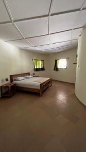 a large room with a large bed in it at Campement Jamarek in Kafountine