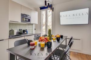 a kitchen with a table with fruit on it at KAZA BELLA - Maisons Alfort 7 - Large modern family flat in Maisons-Alfort