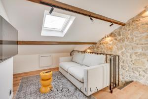 a living room with a white couch and a window at KAZA BELLA - Maisons Alfort 7 - Large modern family flat in Maisons-Alfort