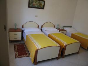 Letto o letti in una camera di Albergo Natucci