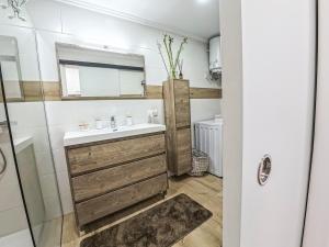 a bathroom with a sink and a mirror at Casa Ari, Beautiful Ocean View in Morro del Jable