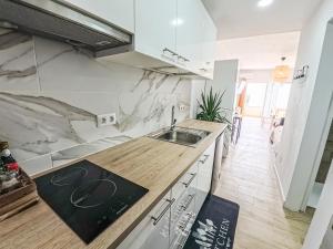 a kitchen with a sink and a counter top at Casa Ari, Beautiful Ocean View in Morro del Jable