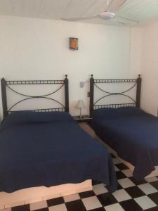 Cama o camas de una habitación en Vacacional Luna Mar