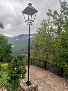 a street light on top of a hill with a view at CASAS RURALES LA TOBICA in Yeste