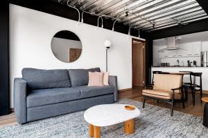 a living room with a couch and a table at Urban Reforma Mexico City by Lumina in Mexico City