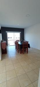a dining room with a table and chairs at DPTOS 3 DE FEBRERO in San Pedro