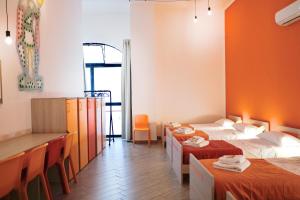 Cortile dei Giusti - Combo Guesthouse客房内的一张或多张床位