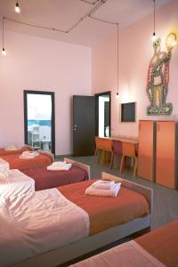 Cortile dei Giusti - Combo Guesthouse客房内的一张或多张床位